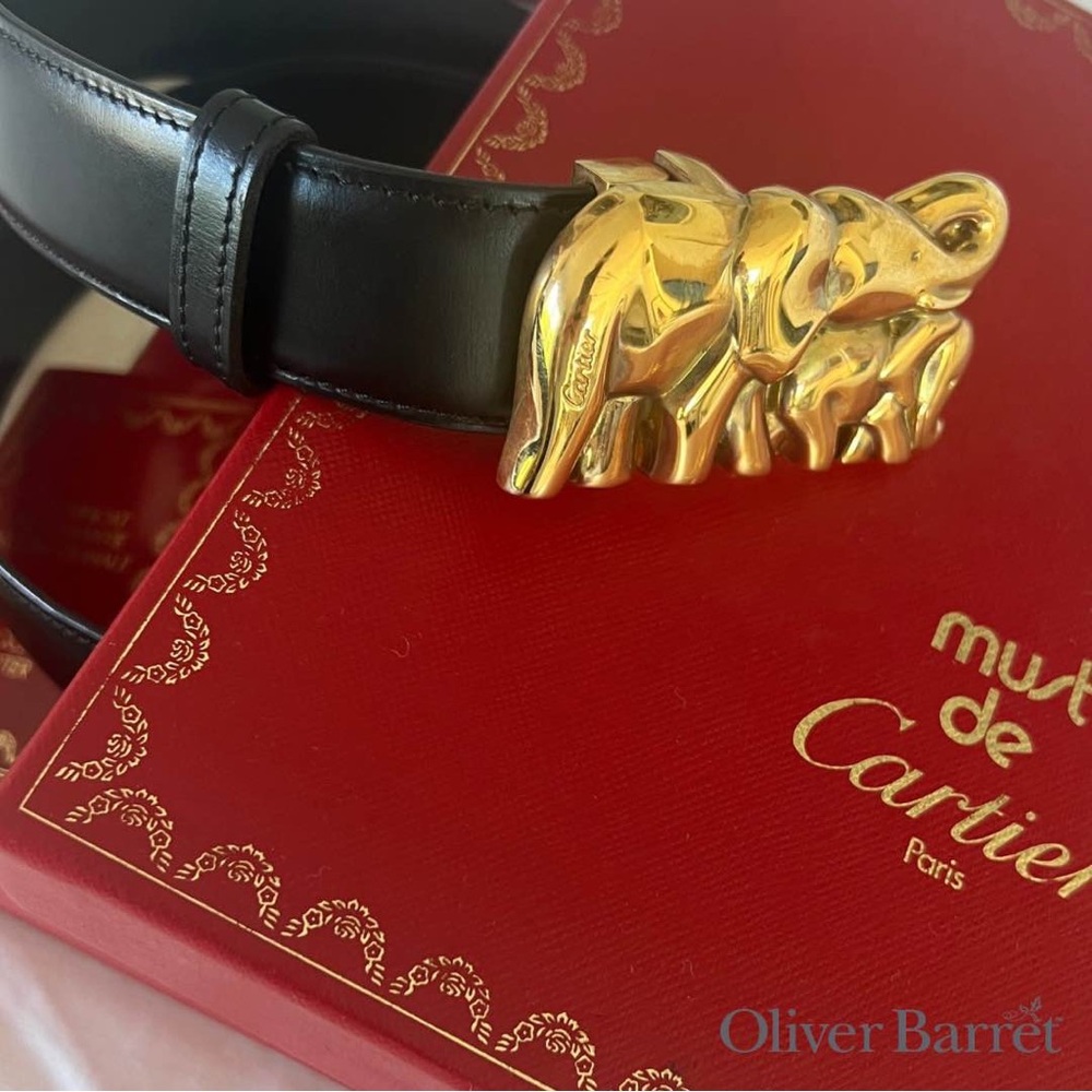 CARTIER BELT IN BLACK LEATHER AND GILDED ELEPHANT BUCKLE